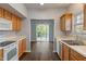Bright dining area with wood cabinets, white countertops, and patio access for seamless indoor-outdoor experience at 4136 Orchard Valley Ln, Indianapolis, IN 46235