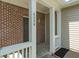 Close-up of a front porch highlighting brick accents and architectural details at 4136 Orchard Valley Ln, Indianapolis, IN 46235