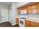 A functional kitchen area featuring essential appliances and ample cabinet space for storage at 4136 Orchard Valley Ln, Indianapolis, IN 46235