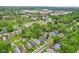 Overhead view of a residential neighborhood with a mix of well-maintained homes and mature trees and green spaces at 4245 Guilford Ave, Indianapolis, IN 46205