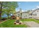 The home has a lovely backyard with a deck, outdoor seating, and fire pit area perfect for relaxation at 4245 Guilford Ave, Indianapolis, IN 46205