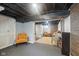 Spacious finished basement area offering versatile living space with room for seating and storage solutions at 4245 Guilford Ave, Indianapolis, IN 46205