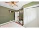 Bedroom view showcasing green walls, with white trim and decor at 4245 Guilford Ave, Indianapolis, IN 46205