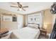 Bedroom featuring large windows, neutral walls, and a ceiling fan at 4245 Guilford Ave, Indianapolis, IN 46205