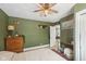 Cozy bedroom featuring green walls, natural light, and comfortable decor at 4245 Guilford Ave, Indianapolis, IN 46205