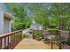 The backyard deck has outdoor seating and table; perfect for enjoying a morning coffee in the fresh air at 4245 Guilford Ave, Indianapolis, IN 46205