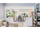 Open-concept dining area with hardwood floors, natural light, and access to the living room at 4245 Guilford Ave, Indianapolis, IN 46205