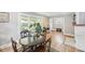 Cozy dining room featuring hardwood floors, natural light, and a view of the front yard at 4245 Guilford Ave, Indianapolis, IN 46205