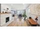 Bright dining room with hardwood floors, a fireplace, and an open layout for entertaining at 4245 Guilford Ave, Indianapolis, IN 46205