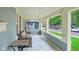 Inviting covered front porch with comfortable seating and string lights at 4245 Guilford Ave, Indianapolis, IN 46205