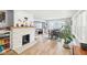 Bright living room featuring a fireplace with decorative tile and adjacent dining area at 4245 Guilford Ave, Indianapolis, IN 46205