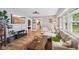 Bright living room with hardwood floors, cozy seating, and large windows at 4245 Guilford Ave, Indianapolis, IN 46205