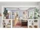Bright living room with hardwood floors, cozy seating, and built-in bookshelves at 4245 Guilford Ave, Indianapolis, IN 46205