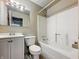 A full bathroom featuring a standard tub, toilet, and single-sink vanity at 425 S Oakland Ave, Indianapolis, IN 46201
