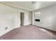 This bedroom offers neutral walls, carpet flooring, and a window air conditioning unit at 425 S Oakland Ave, Indianapolis, IN 46201