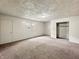 Large bedroom with two windows, standard closet, and carpet flooring, awaiting personalization at 425 S Oakland Ave, Indianapolis, IN 46201