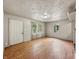 Bright living room with natural light, wood floors, and neutral walls at 425 S Oakland Ave, Indianapolis, IN 46201