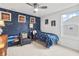 Cozy bedroom decorated with galaxy-themed wallpaper, an armchair, side tables, and a neutral carpet at 4629 Rainwater Ln, Whitestown, IN 46075