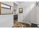 Inviting hallway with wood flooring, a decorative mirror and access to other rooms at 4629 Rainwater Ln, Whitestown, IN 46075