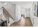 Spacious hallway with hardwood floors and a staircase leading to the upper level at 4629 Rainwater Ln, Whitestown, IN 46075
