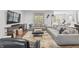 Inviting living room with stylish sectional, media console, and sun-filled windows at 4629 Rainwater Ln, Whitestown, IN 46075