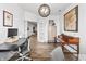 Spacious home office with wood floors, modern lighting, and ample workspace, perfect for a professional setting at 4629 Rainwater Ln, Whitestown, IN 46075