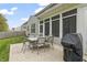 Patio with seating, grill, screened-in porch, offering an ideal outdoor dining and relaxing space at 4629 Rainwater Ln, Whitestown, IN 46075