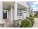 Welcoming porch features stone accents, white columns, and a stylish entrance, enhancing curb appeal at 4629 Rainwater Ln, Whitestown, IN 46075