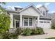 Charming porch with stone accents, white columns, and a cozy bench, perfect for relaxing outdoors at 4629 Rainwater Ln, Whitestown, IN 46075