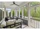 Screened-in porch with comfortable seating and ceiling fan, perfect for outdoor relaxation and entertaining at 4629 Rainwater Ln, Whitestown, IN 46075