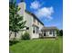 Spacious backyard with a deck and a sunroom addition to the home at 4719 Arabian Run, Indianapolis, IN 46228