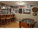 Finished basement with custom bar, seating, and foosball table for entertainment at 4719 Arabian Run, Indianapolis, IN 46228