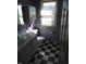 A bathroom featuring a checkered floor, toilet, vanity and sink at 4719 Arabian Run, Indianapolis, IN 46228