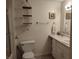 Clean bathroom with a vanity sink, toilet, and a shower behind a glass door at 4719 Arabian Run, Indianapolis, IN 46228