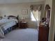 Cozy bedroom featuring a comfortable bed, bedside table, and elegant decor at 4719 Arabian Run, Indianapolis, IN 46228