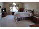 Spacious main bedroom featuring neutral carpeting and a large window at 4719 Arabian Run, Indianapolis, IN 46228