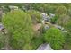 Tranquil residential area boasts homes nestled among mature trees, and lush lawns at 4810 Winthrop Ave, Indianapolis, IN 46205