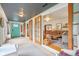 Inviting sunroom seamlessly connects to the living area, featuring natural light and stylish furnishings at 4810 Winthrop Ave, Indianapolis, IN 46205