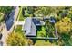 Aerial view of home highlighting fenced yard, mature trees and meticulous landscaping at 51 Wilson Dr, Carmel, IN 46032