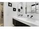 Bathroom features a double vanity, dark fixtures and a standing shower at 51 Wilson Dr, Carmel, IN 46032