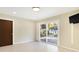 Bedroom featuring a slider leading to the backyard, a modern ceiling light, and neutral paint at 51 Wilson Dr, Carmel, IN 46032