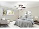 Cozy bedroom featuring a ceiling fan, a comfortable bed and a window providing natural light at 51 Wilson Dr, Carmel, IN 46032