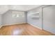 Comfortable bedroom featuring sleek flooring, storage shelves, and natural light from window at 51 Wilson Dr, Carmel, IN 46032