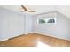 Bright bedroom with hardwood floors, ceiling fan, and natural light from the window at 51 Wilson Dr, Carmel, IN 46032
