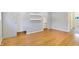 Bedroom featuring pristine hardwood floors, large closet doors, and neutral grey walls at 51 Wilson Dr, Carmel, IN 46032