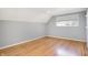 Bright bedroom with wood floors, large window, and light gray walls at 51 Wilson Dr, Carmel, IN 46032