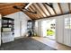 Well-lit garage with storage shelves and epoxy flooring provides ample space for parking and projects at 51 Wilson Dr, Carmel, IN 46032