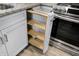 Kitchen cabinet detail showing pull out shelving for pantry style storage and maximizing space at 51 Wilson Dr, Carmel, IN 46032