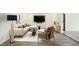 Bright living room with contemporary decor, large sectional, and a mounted TV for entertainment at 51 Wilson Dr, Carmel, IN 46032