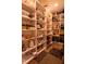 Walk-in pantry offers lots of shelving for organized food and appliance storage at 51 Wilson Dr, Carmel, IN 46032